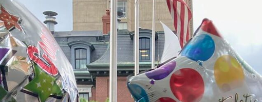 Mylar balloons saying "congratulations"