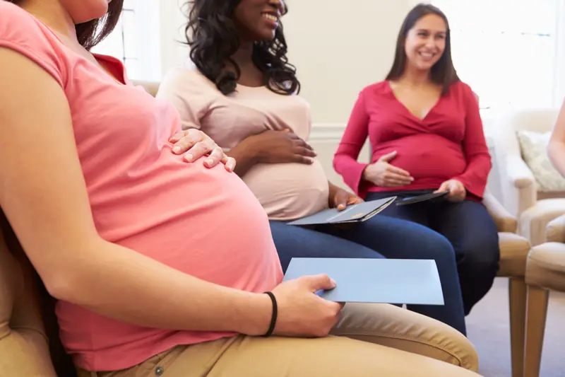 Pregnant Women Meeting At Ante Natal Class To Discuss Pregnancy