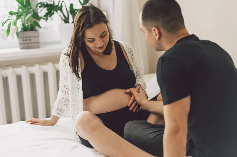 Young beautiful couple expecting a baby. Happy family life concept