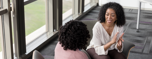 A high angle view of a mature adult therapist and mid adult patient working on issues.