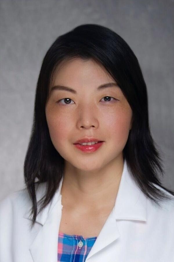 Photographic portrait (vertical) of Yiqin Xiong, MD, PhD, clinical pathologist (2:3 crop)